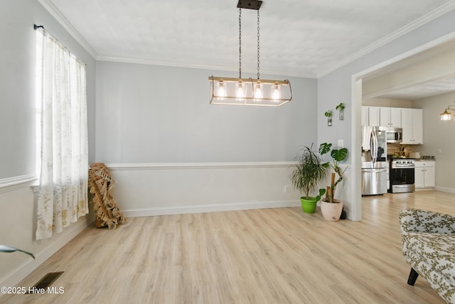 118 Stedman Ln E, Elizabeth City, NC 27909 - dining room with light wood-type flooring, ornamental molding, and baseboards