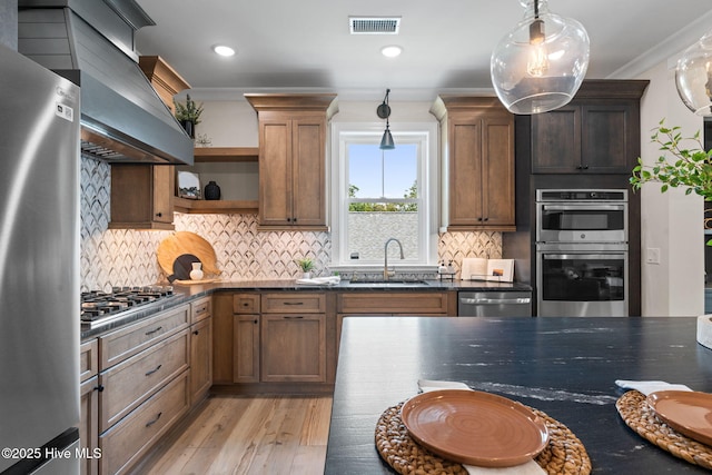 412 Keziah St, Oak Island, NC 28465 - kitchen with a sink, appliances with stainless steel finishes, open shelves, light wood-type flooring, and ventilation hood