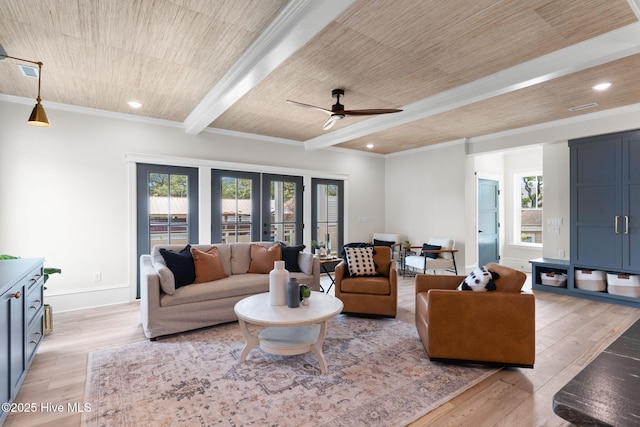 412 Keziah St, Oak Island, NC 28465 - living room featuring plenty of natural light, ceiling fan, beam ceiling, light wood-style floors, and ornamental molding
