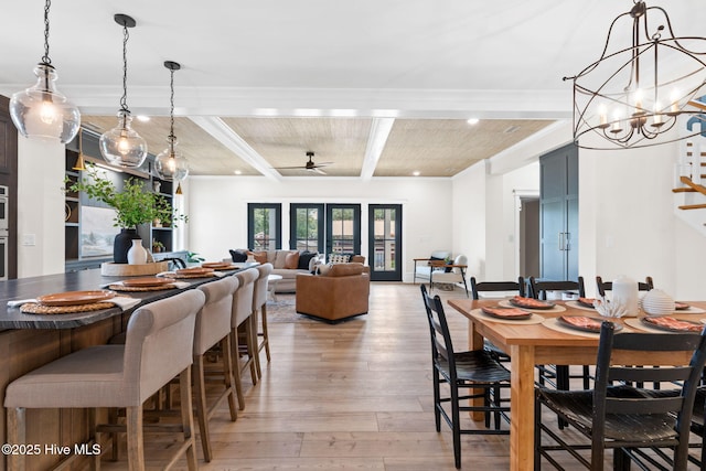 412 Keziah St, Oak Island, NC 28465 - dining room with light wood-style flooring, beamed ceiling, ceiling fan, recessed lighting, and a chandelier