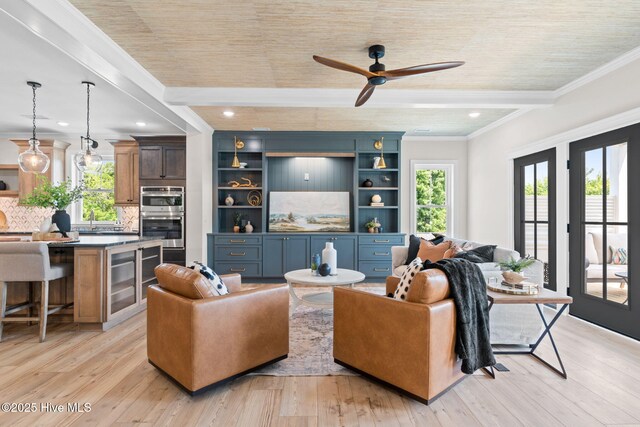 412 Keziah St, Oak Island, NC 28465 - living room featuring healthy amount of natural light, a ceiling fan, ornamental molding, light wood-style flooring, and recessed lighting
