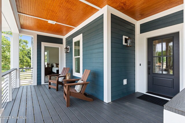 412 Keziah St, Oak Island, NC 28465 - view of wooden porch