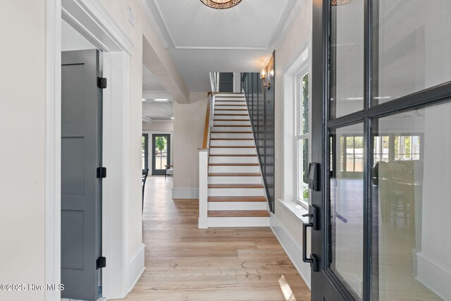 412 Keziah St, Oak Island, NC 28465 - entrance foyer featuring light wood-style flooring, stairway, french doors, and baseboards