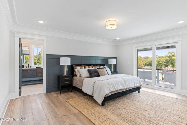 412 Keziah St, Oak Island, NC 28465 - bedroom with access to outside, light wood-style floors, crown molding, recessed lighting, and connected bathroom