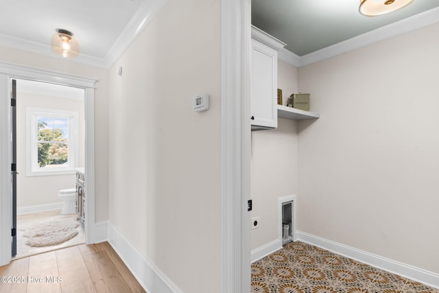 412 Keziah St, Oak Island, NC 28465 - laundry room featuring cabinet space, crown molding, electric dryer hookup, and baseboards