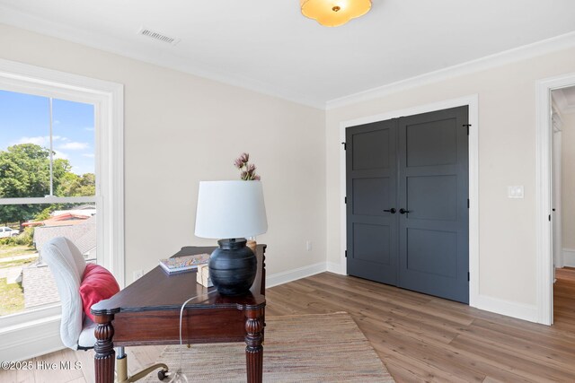412 Keziah St, Oak Island, NC 28465 - office space featuring light wood-type flooring, baseboards, and crown molding