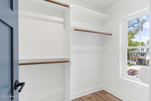 412 Keziah St, Oak Island, NC 28465 - walk in closet featuring wood finished floors