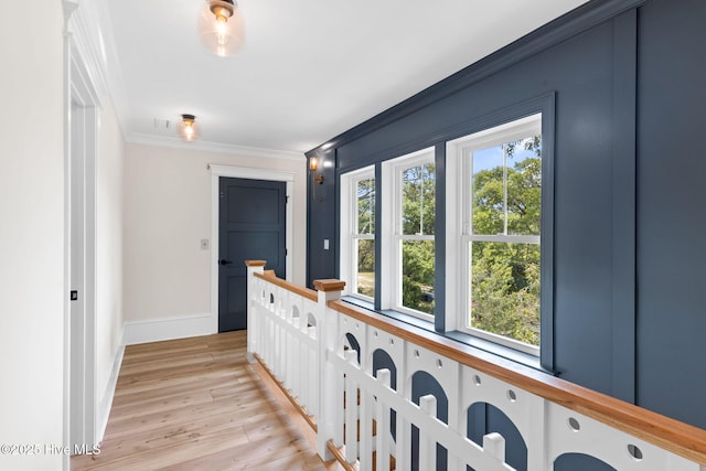 412 Keziah St, Oak Island, NC 28465 - hallway featuring ornamental molding, light wood-style floors, and baseboards