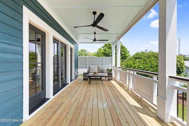 412 Keziah St, Oak Island, NC 28465 - wooden terrace with a ceiling fan