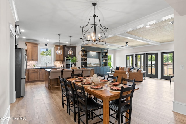412 Keziah St, Oak Island, NC 28465 - dining space with light wood-style flooring, ornamental molding, a chandelier, recessed lighting, and ceiling fan