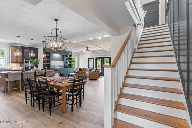 412 Keziah St, Oak Island, NC 28465 - dining area with stairway, ceiling fan, plenty of natural light, light wood-style flooring, and beamed ceiling