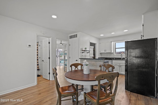 1503 Carolina Beach Ave N Unit 2A, Carolina Beach, NC 28428 - dining space with light wood finished floors, baseboards, and recessed lighting