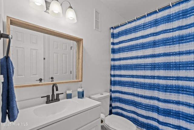 1503 Carolina Beach Ave N Unit 2A, Carolina Beach, NC 28428 - full bathroom with toilet, vanity, and a shower with curtain