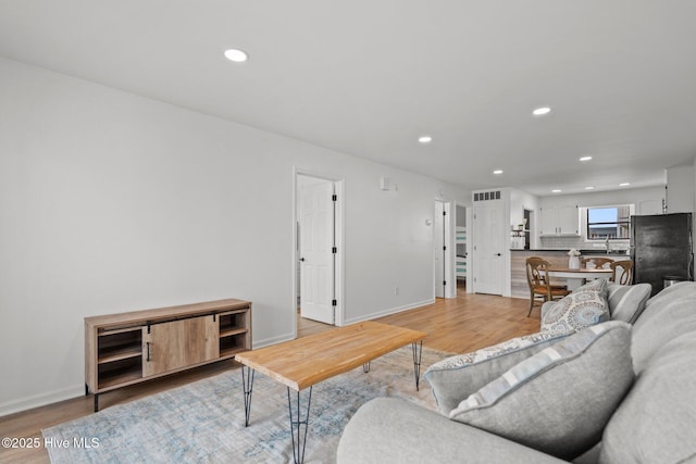 1503 Carolina Beach Ave N Unit 2A, Carolina Beach, NC 28428 - living room with light wood-type flooring, recessed lighting, and baseboards