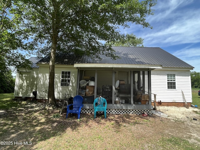 1412 Lyon Landing Rd, Elizabethtown, NC 28337 - rear view of property featuring a sunroom and metal roof