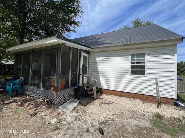 1412 Lyon Landing Rd, Elizabethtown, NC 28337 - rear view of property with a sunroom, metal roof, and entry steps