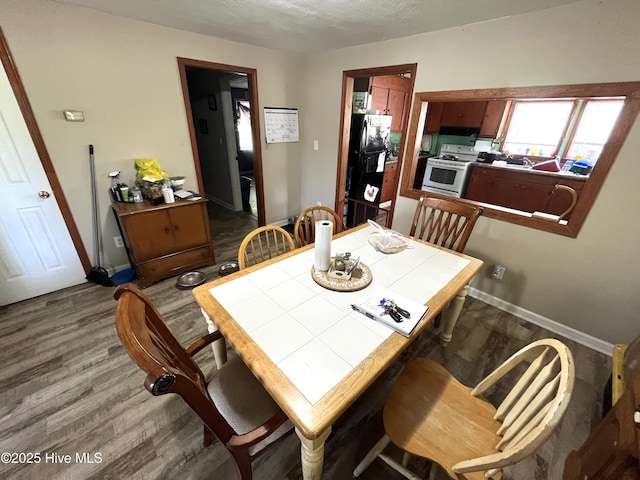 1412 Lyon Landing Rd, Elizabethtown, NC 28337 - dining area with wood finished floors and baseboards