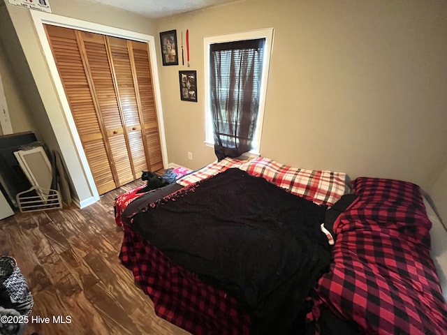 1412 Lyon Landing Rd, Elizabethtown, NC 28337 - bedroom featuring wood finished floors, a closet, and baseboards