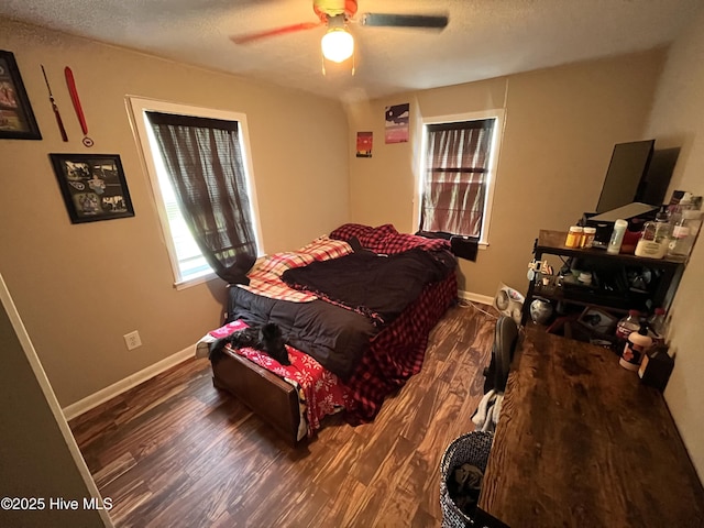 1412 Lyon Landing Rd, Elizabethtown, NC 28337 - bedroom featuring wood finished floors, baseboards, a textured ceiling, and a ceiling fan