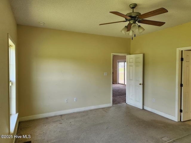 5702 Whichard Rd, Stokes, NC 27884 - spare room with carpet floors, ceiling fan, baseboards, a smoke detector, and a textured ceiling
