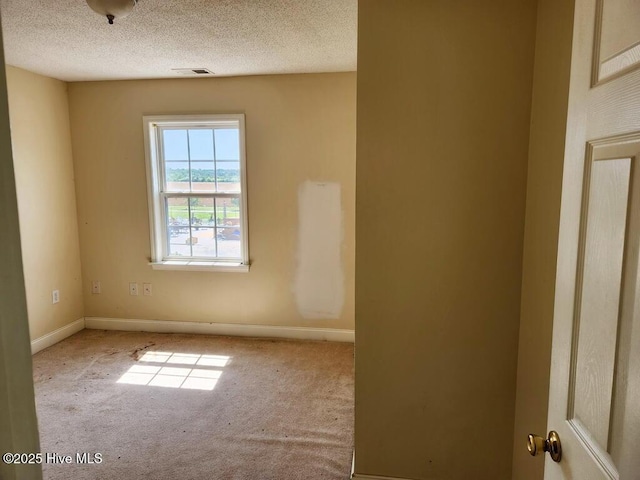 5702 Whichard Rd, Stokes, NC 27884 - empty room with carpet floors, baseboards, and a textured ceiling
