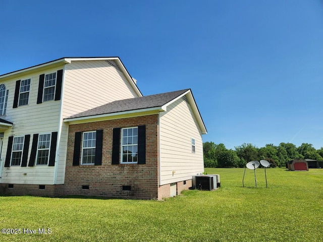 5702 Whichard Rd, Stokes, NC 27884 - view of property exterior featuring crawl space, a yard, and central AC unit