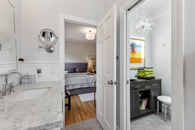 8300 Fazio Dr, Wilmington, NC 28411 - bathroom with ornamental molding, ensuite bath, a chandelier, and vanity