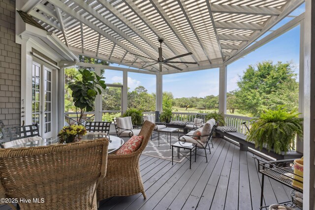 8300 Fazio Dr, Wilmington, NC 28411 - wooden deck featuring an outdoor hangout area, a pergola, and a ceiling fan