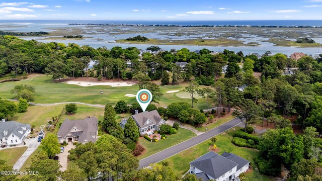 8300 Fazio Dr, Wilmington, NC 28411 - aerial view of property and surrounding area with a large body of water, a local golf course, nearby suburban area, and a tree filled landscape