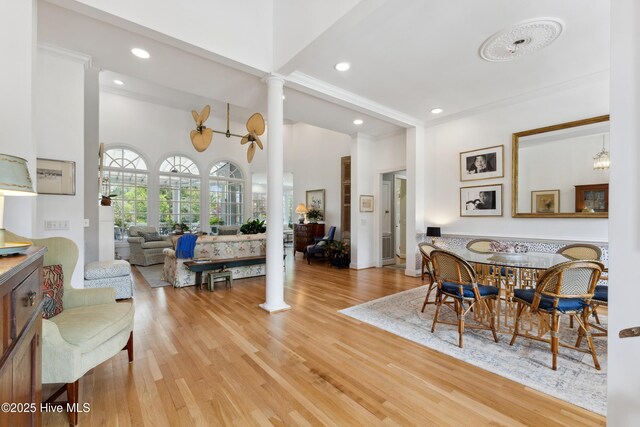 8300 Fazio Dr, Wilmington, NC 28411 - dining space featuring ornate columns, light wood-style flooring, and recessed lighting