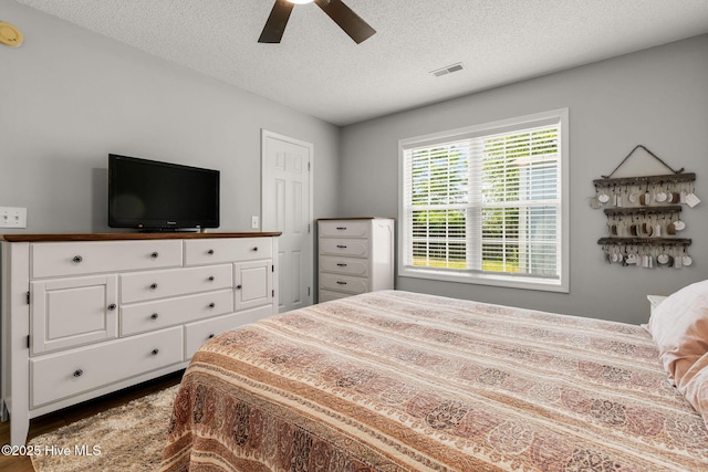 7321 Haskell Ct, Wilmington, NC 28411 - bedroom featuring a textured ceiling and a ceiling fan