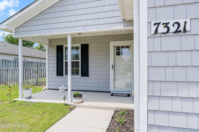 7321 Haskell Ct, Wilmington, NC 28411 - doorway to property featuring covered porch