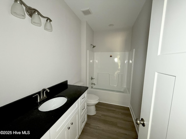 158 Texas Rd, Shiloh, NC 27974 - full bath with toilet, vanity, wood finished floors, shower / tub combination, and baseboards