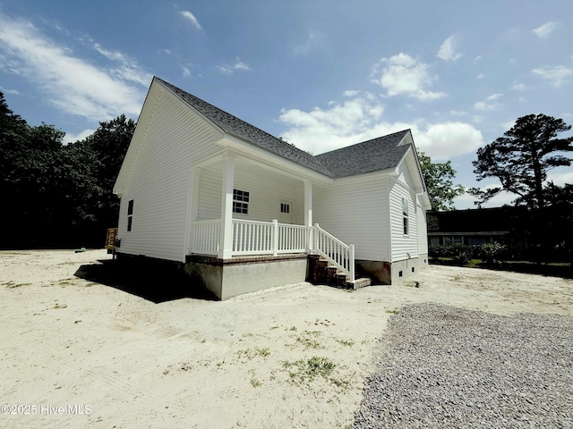 158 Texas Rd, Shiloh, NC 27974 - view of side of property with covered porch and a shingled roof