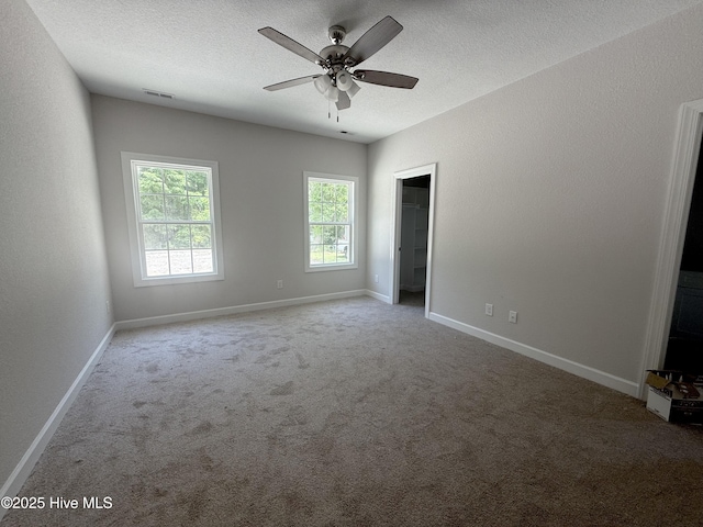 158 Texas Rd, Shiloh, NC 27974 - unfurnished bedroom with carpet floors, a textured ceiling, baseboards, and a ceiling fan