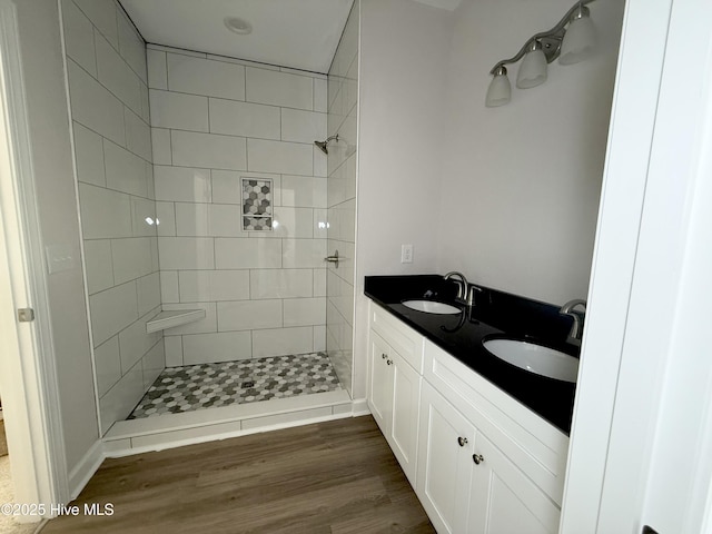 158 Texas Rd, Shiloh, NC 27974 - full bath with tiled shower, double vanity, and wood finished floors