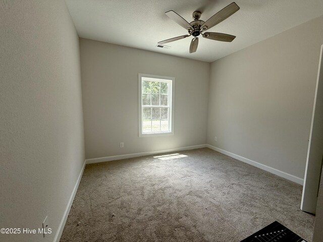 158 Texas Rd, Shiloh, NC 27974 - unfurnished room with carpet floors, baseboards, and a ceiling fan