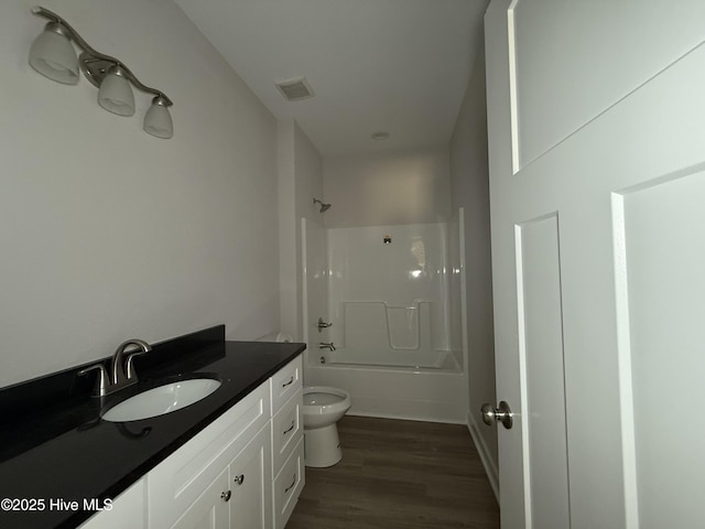 158 Texas Rd, Shiloh, NC 27974 - full bathroom featuring toilet, vanity, wood finished floors, and bathing tub / shower combination