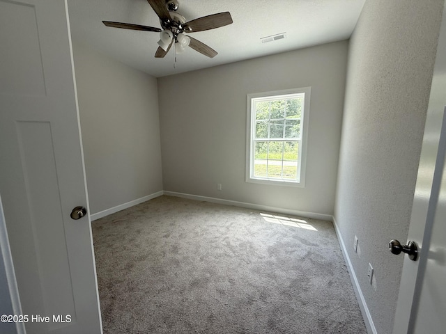 158 Texas Rd, Shiloh, NC 27974 - empty room featuring carpet flooring, baseboards, and a ceiling fan