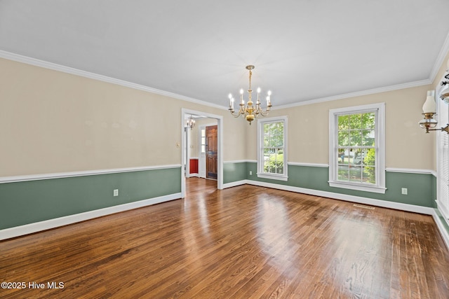 1510 Lucerne Way, New Bern, NC 28560 - unfurnished room with a chandelier, wood finished floors, crown molding, and baseboards
