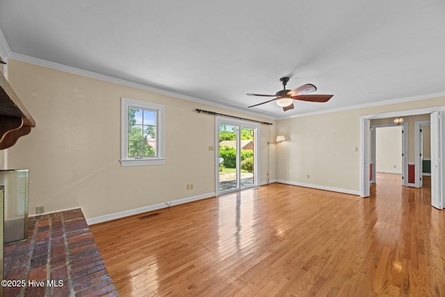 1510 Lucerne Way, New Bern, NC 28560 - unfurnished living room featuring ornamental molding, wood finished floors, ceiling fan, and baseboards