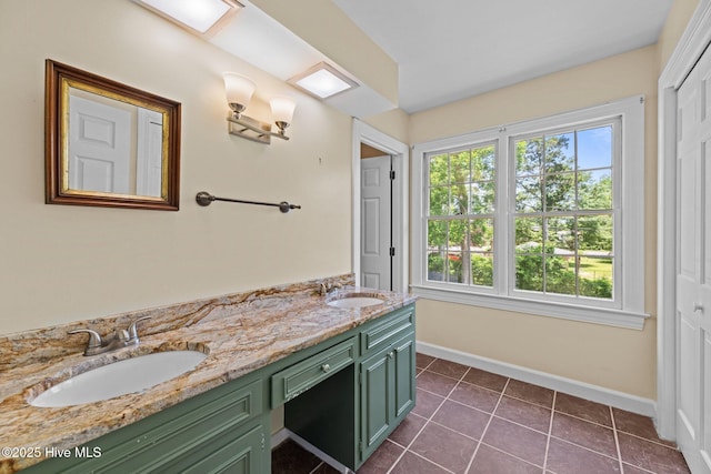 1510 Lucerne Way, New Bern, NC 28560 - bathroom with double vanity, baseboards, and tile patterned flooring