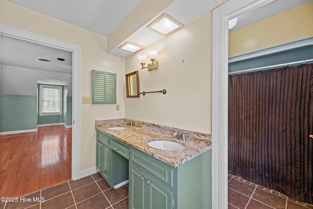 1510 Lucerne Way, New Bern, NC 28560 - full bathroom with double vanity, baseboards, and tile patterned floors