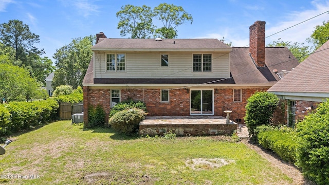 1510 Lucerne Way, New Bern, NC 28560 - rear view of property with a patio area, a chimney, and brick siding
