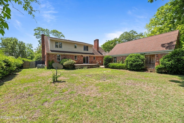 1510 Lucerne Way, New Bern, NC 28560 - rear view of house with brick siding, a chimney, and cooling unit