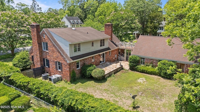 1510 Lucerne Way, New Bern, NC 28560 - rear view of house with a chimney, brick siding, and central AC unit