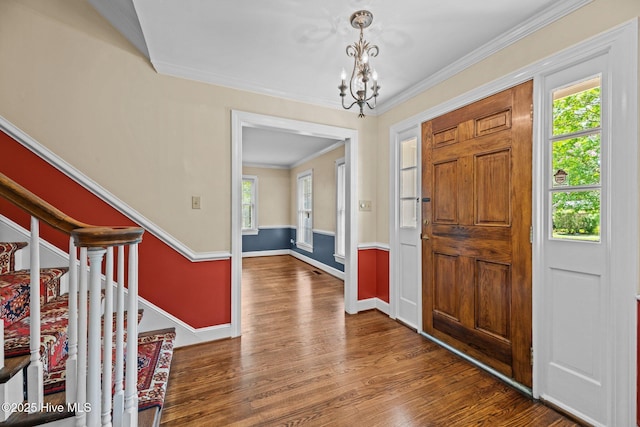 1510 Lucerne Way, New Bern, NC 28560 - foyer entrance with wood finished floors, a chandelier, crown molding, stairs, and baseboards