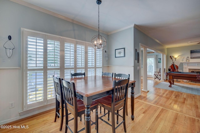 809 Berwyn Rd, Wilmington, NC 28409 - dining room featuring light wood-type flooring, a chandelier, crown molding, billiards table, and baseboards