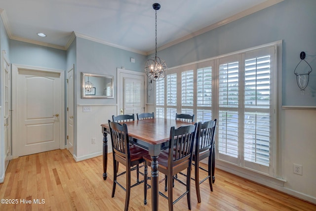 809 Berwyn Rd, Wilmington, NC 28409 - dining space with a chandelier, light wood-style flooring, healthy amount of natural light, and ornamental molding