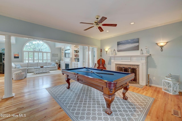 809 Berwyn Rd, Wilmington, NC 28409 - rec room featuring a fireplace, crown molding, a ceiling fan, light wood-style floors, and pool table